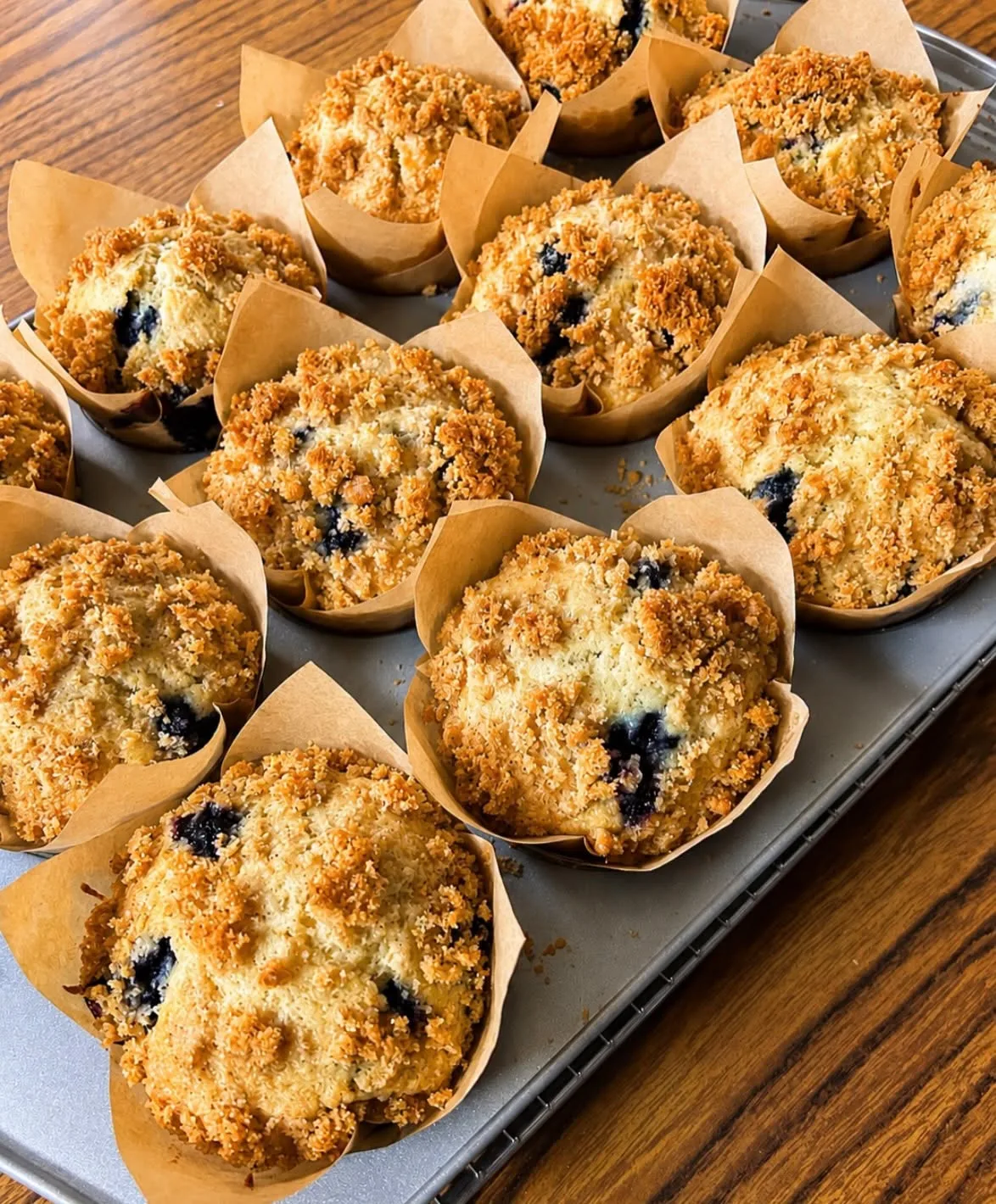 Blueberry crumb muffins in paper tulip liners
