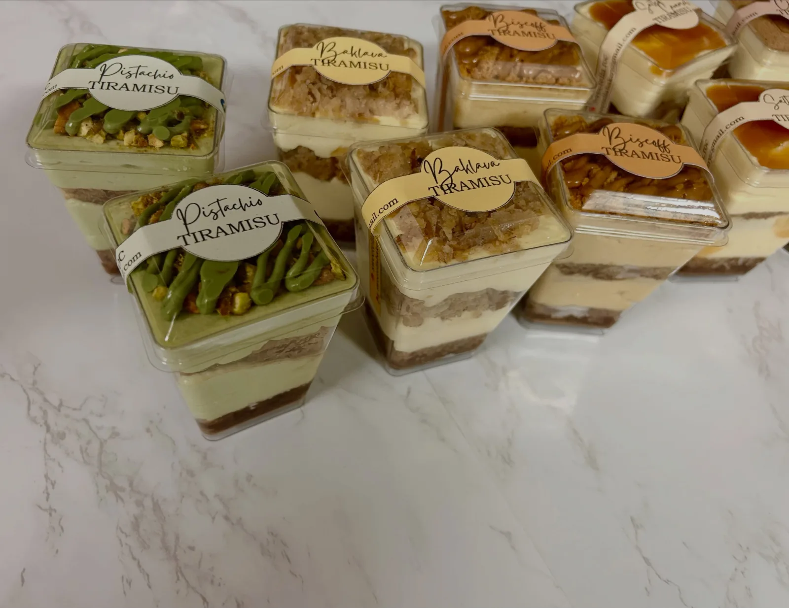 Layered pistachio tiramisu in clear dessert cups